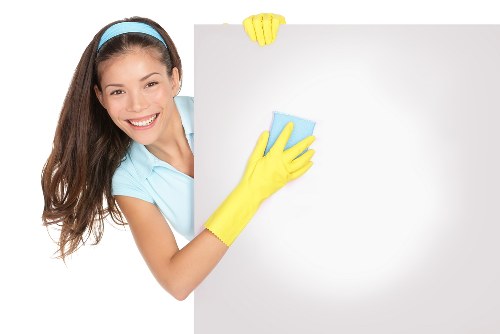Supervisor reviewing workplace safety standards for cleaning operations